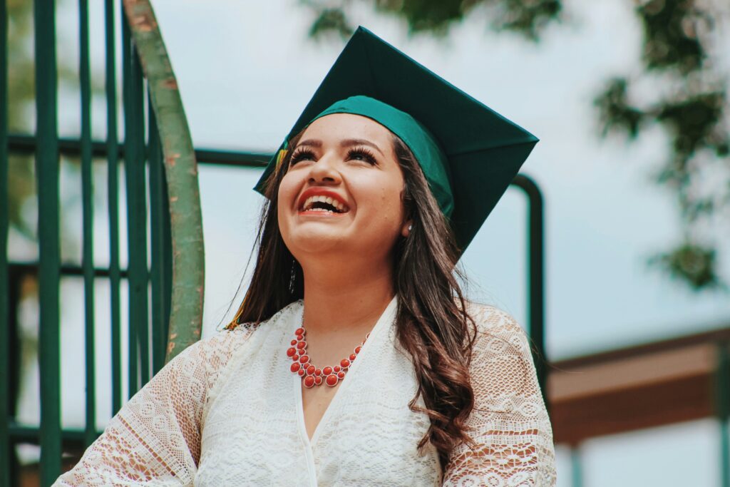 Graduate smiling wearing her graduation cap