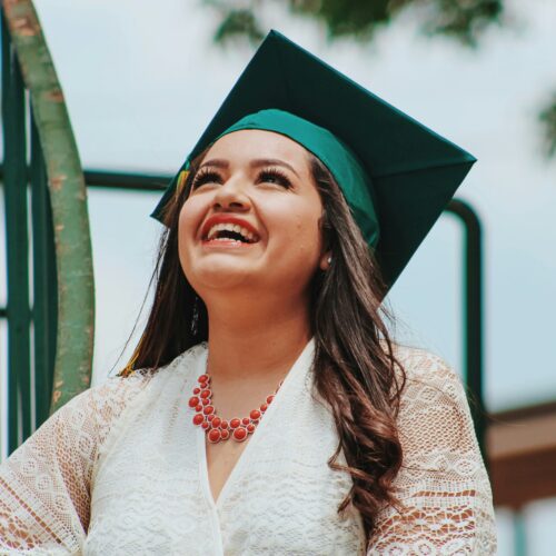 Graduate smiling wearing her graduation cap